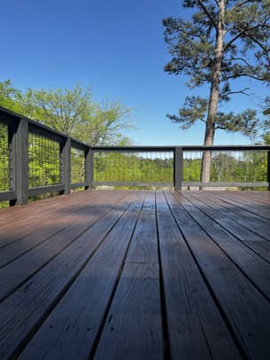 Alabama Deck Restoration logo featuring a house, a paintbrush, and the slogan Love Your Deck Again.
