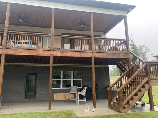 Ipe wood deck with specialized maintenance to prevent UV graying and moisture checking