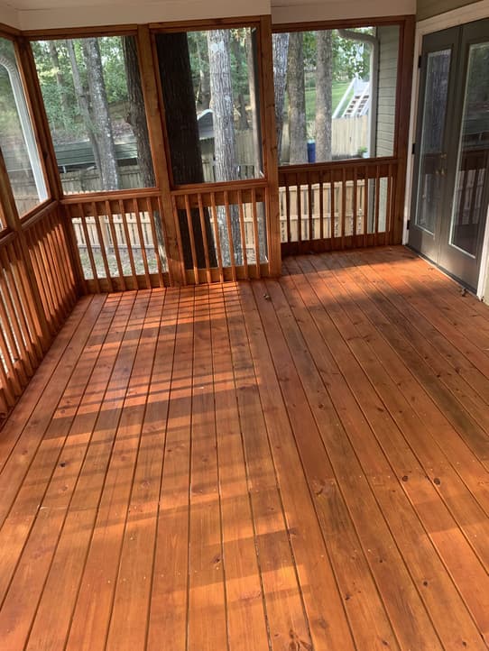 Deck repair specialist shoring up a damaged deck post in Mountain Brook